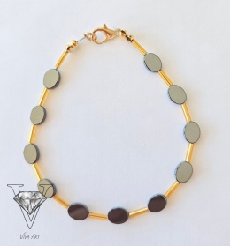 BRANSOLETKA UNIWERSALNA Z CZARNYCH OWALNYCH HEMATYTÓW I  ZŁOTYCH SZKLANYCH PRZEKŁADEK